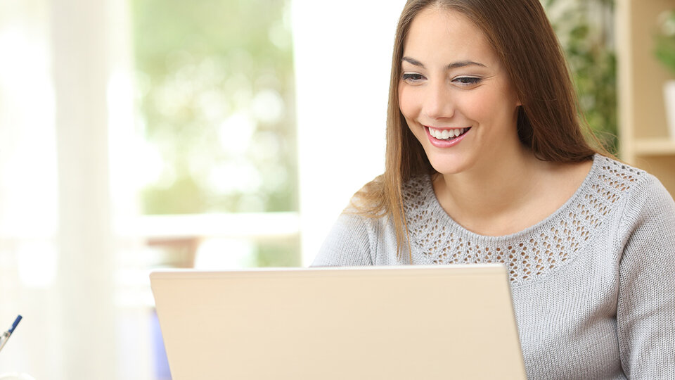 Woman sitting at laptop