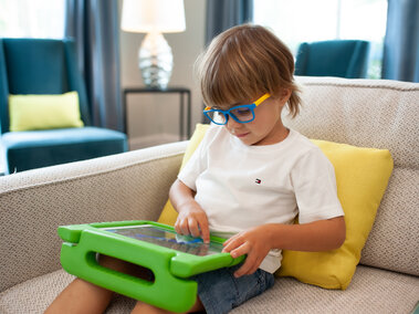 young child navigating a tablet