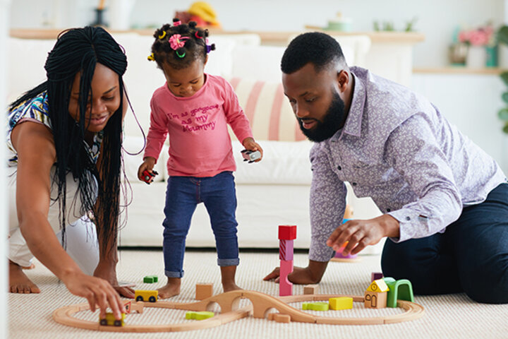 Father and Mother playing with kid